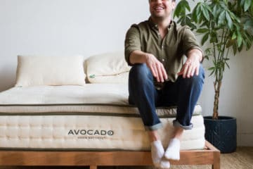 Man Sitting on Avocado Mattress